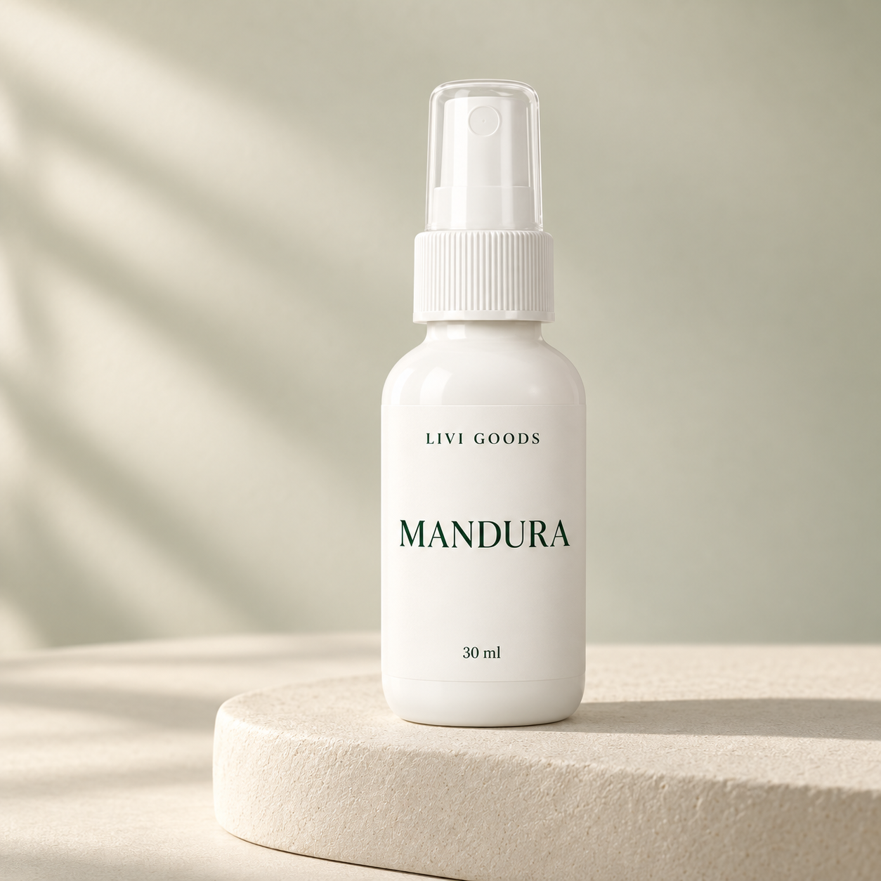 Illustrative Livi Goods Mandura 30 ml bottle on a stone plinth